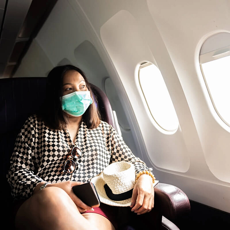 Image of Woman safe travels on airplane